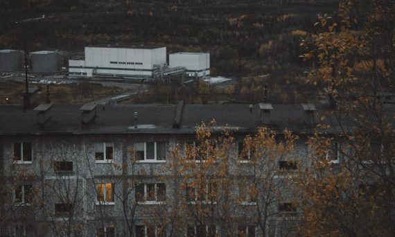 Industrial buildings and apartment block in autumn
