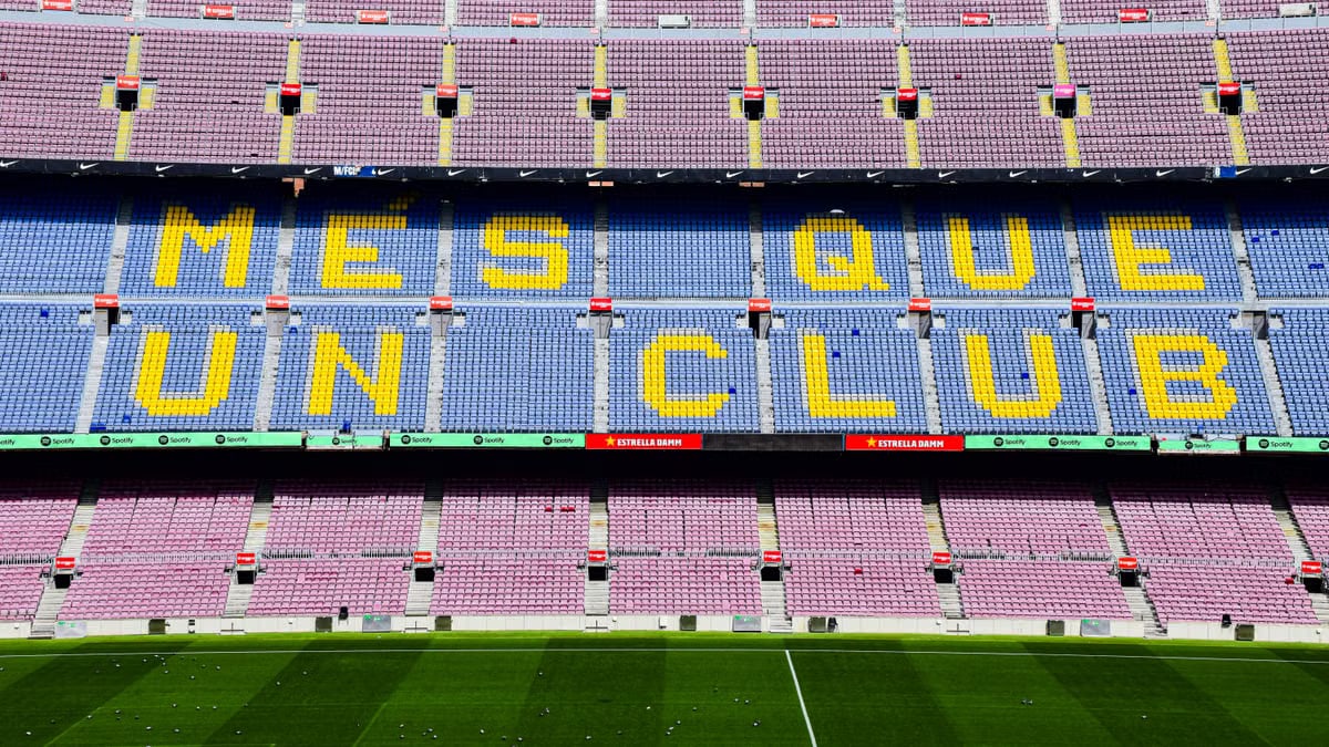 The iconic "Mes Que Un Club" slogan displayed at the Camp Nou stadium in Barcelona, Spain.